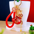 Fortune Pouch Keychains With Enamel Centers and Braided Wrist Straps view 1