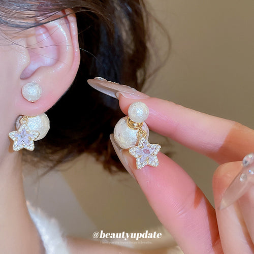 Styled wear view of textured white pearl-like studs with clear crystal star and pearl-like drops