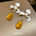 White Enamel Flower Stud Earrings With Yellow Drops view 4