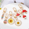 Gold Tone Colorful Feather Flower and Mushroom Clip Keychains view 1