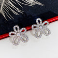 Open Flower Crystal Stud Earrings in Polished Metal view 2
