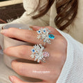 Silver Open Floral Bouquet Ring Oval Center Stone Two Colors view 1