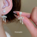 Silver Bow Pearl Fringe Stud Earrings with Polished Metal Details view 4