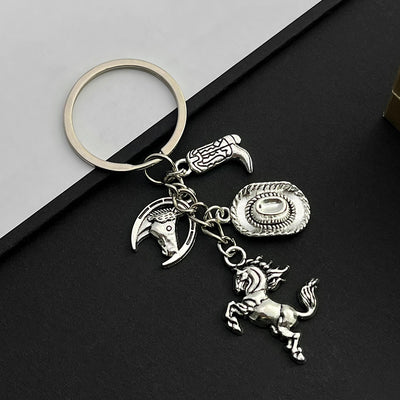 Front product photo of antique silver and gold western horse hat and boot charm keychains showing the pictured design ar