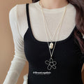 Silver Flower Pendant And Baroque Pearl Cord Necklaces view 1