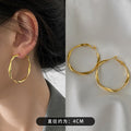 Twisted Metal Hoop Earrings In Three Sizes And Colors view 1