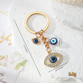 Gold Tone Blue Evil Eye Charm Keychains in Eight Designs view 10
