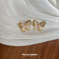 Gold Tone Butterfly Stud Earrings with Pink Crystal Centers view 2