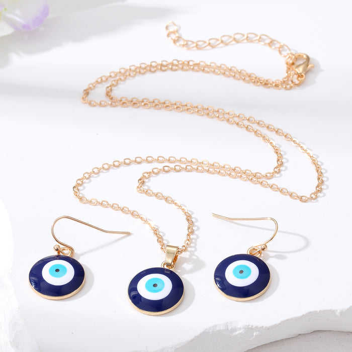 Gold and Silver Tone Navy Evil Eye Earrings and Necklaces