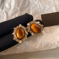 Amber Oval Stud Earrings with Clear Crystal Halo Frames view 6
