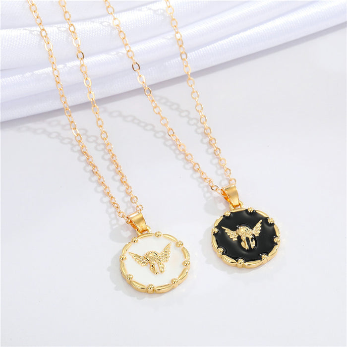 Gold Tone Black and White Winged Skull Round Pendant Necklaces