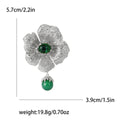 Green Center Flower Brooch With Hanging Bead With Polished Metal Detail view 7