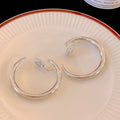 Rounded Hoop Clip Earrings in Gold and Silver Tone view 6