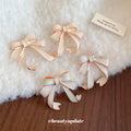 Layered Ribbon Bow Stud Earrings in White or Beige view 4