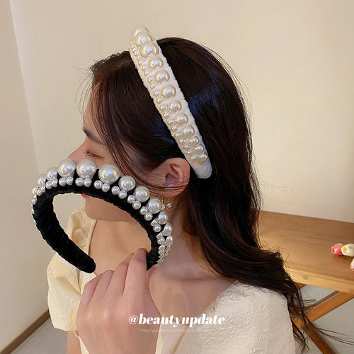 padded velvet headband with graduated pearl-like beads shown worn in a styled second view