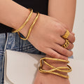 Sculptural Crossing Loop Open Cuff in Gold and Silver Tone view 3