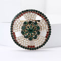 Round Crystal Wreath Brooch Emerald Center Red Green Rim view 2