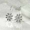 White Gold Daisy Flower Hook Earrings Textured Center Detail view 3