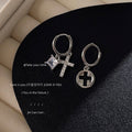 Silver Asymmetric Cross Charm Huggie Hoop Earrings Pair view 1