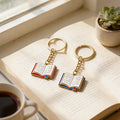 Open Book Sun Face Enamel Keychain Blue or Red Cover view 4
