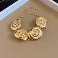 Gold Spiral Shell Necklace Bracelet Earrings and Ring view 8