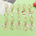 Cat Charm Keychains Featuring White Flower Across 19 Pictured Variations view 4