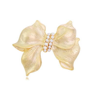 Front product view of the ribbon bow brooch pin in gold