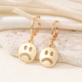 Frowning Face Huggie Drop Earrings in Gold and Silver Tone view 2