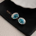 Aqua Blue Oval Clear Halo Silver Tone Stud Earrings view 3