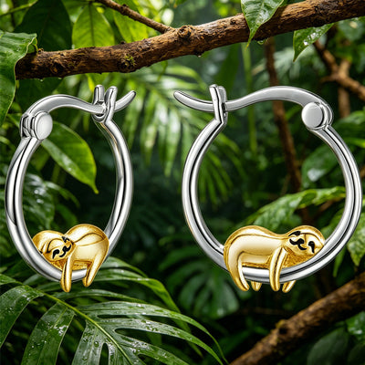 Two-tone sloth hoops hanging on jungle branch with green leaves