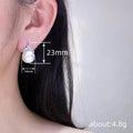 Silver Tone Crown Pearl Stud Earrings Clear Pavé Top view 4
