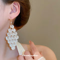 Gold Tone Crystal Leaf Cluster Hook Earrings With Teardrop Fringe view 3
