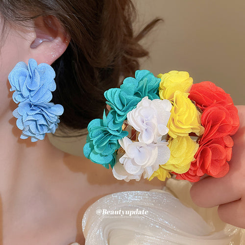 彩色雪纺花朵C形耳环 shown worn for scale and shape