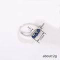 Three Blue Oval Stone Crisscross Ring In Polished Silver Tone view 4