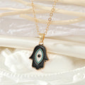 Gold Tone Black Enamel Hamsa Eye Necklace and Hook Earrings view 4