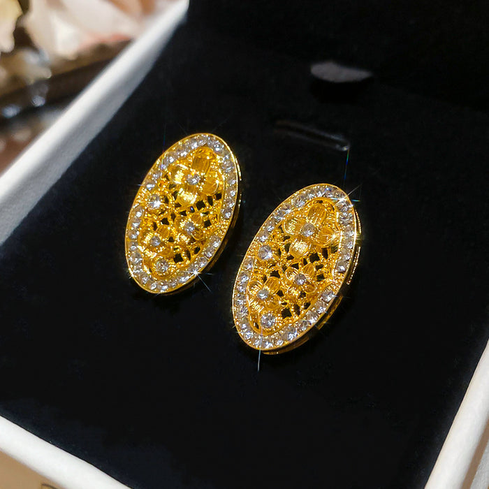 Gold Tone Open Oval Stud Earrings with Clear Crystal Borders
