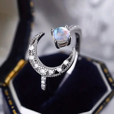 Silver crescent moon moonstone-look open ring in jewelry box