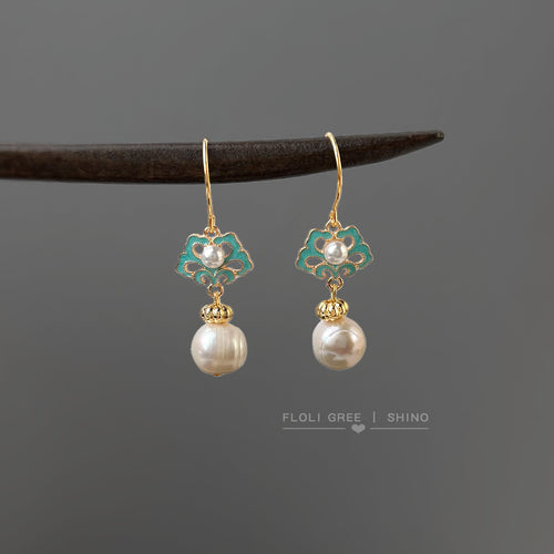 Turquoise enamel ruyi pearl drops hanging from dark wood stick