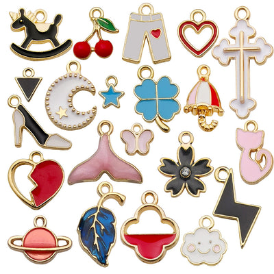 Colorful heart and four-leaf clover charms arranged on a light background
