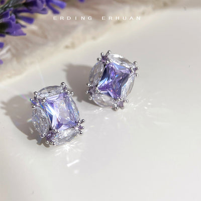 Silver-tone lavender rectangle clear-oval stone studs in the first product display.