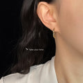 Gold Abstract Face Profile Open Hoop Earrings Minimal Outline Pair view 2