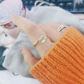 Embracing Hands Adjustable Open Band Rings in Four Finishes view 2