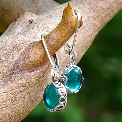 Product view 1 showing teal oval drops with silver-tone caps