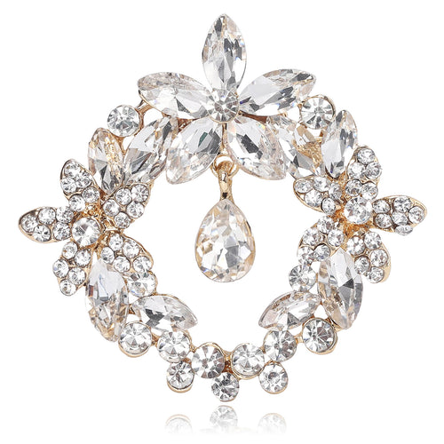 Angled display of round floral crystal wreath surrounding a suspended teardrop stone