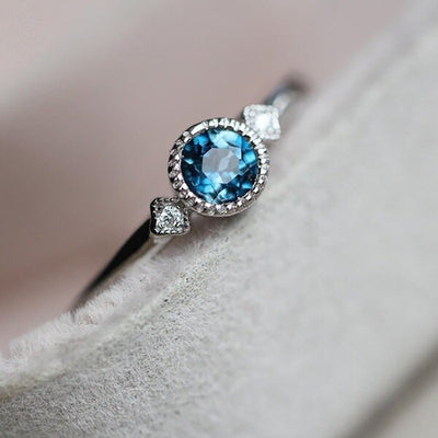 Image 5 showing blue round crystal twist band ring