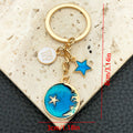 Six Blue Zodiac Moon and Star Metal Keychain Designs view 10