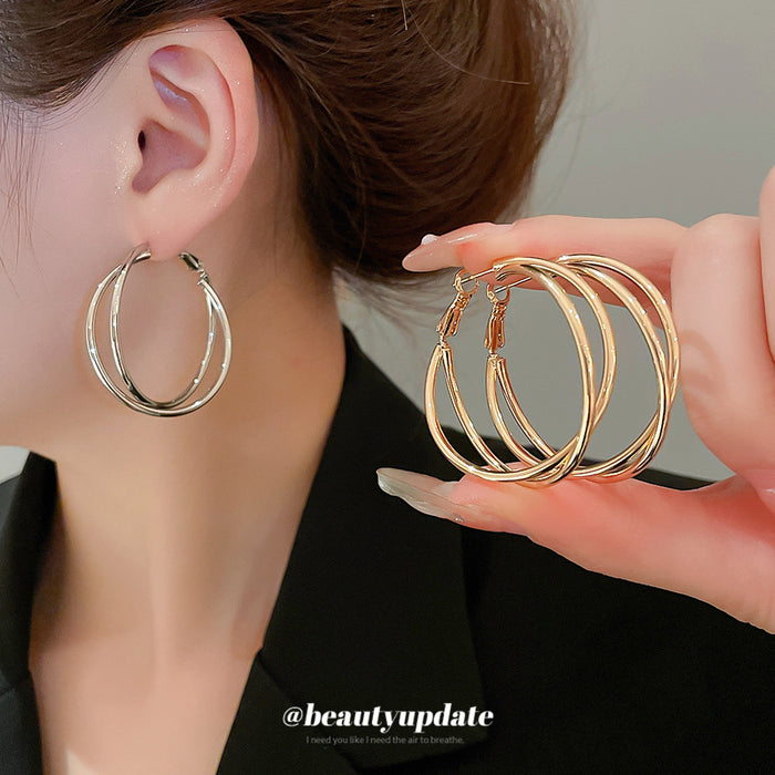 Twisted Double Hoop Earrings in Gold and Silver Tones