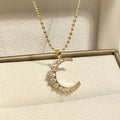 Gold Tone Crescent Moon Pendant Necklace with Clear Stones view 3