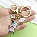 Gold-Tone Space Metal Keychains with Astronaut and Rocket Charms view 3