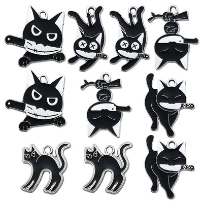 Black assorted shape charms arranged on a light background